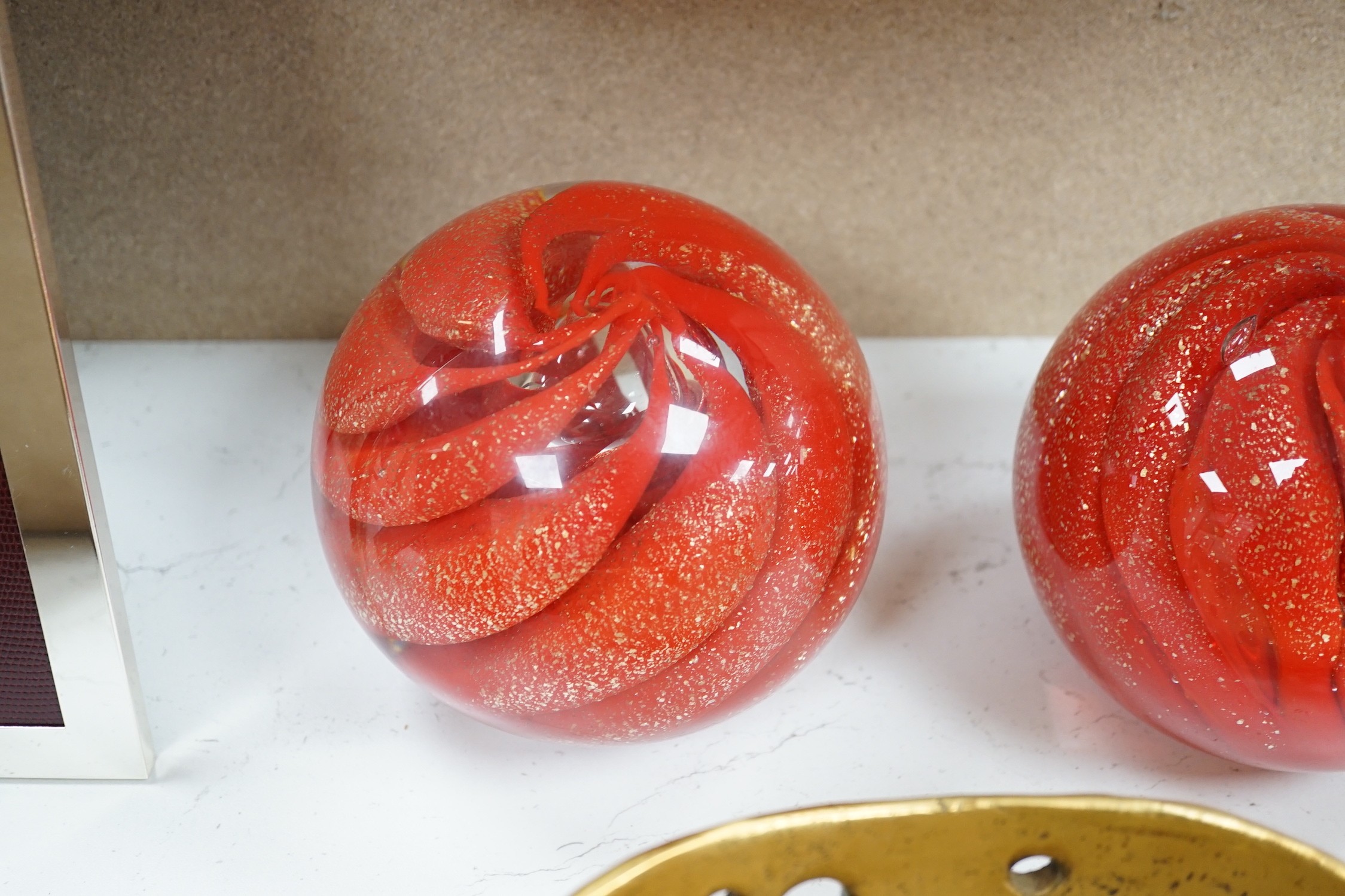 A pair of globular coloured glass ornaments and an art-bronze bowl, 33cm diameter